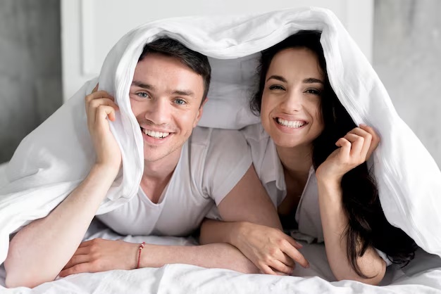 ai photo editing prompt for couple-wrapped in a blanket