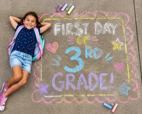 student with sidewalk chalk art