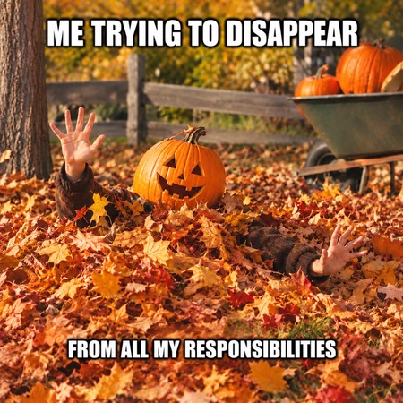 person hiding in autumn leaves with a pumpkin